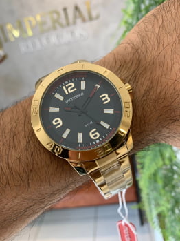 Relógio Mondaine Masculino Dourado visor preto a prova d´água 99351GPMVDE2