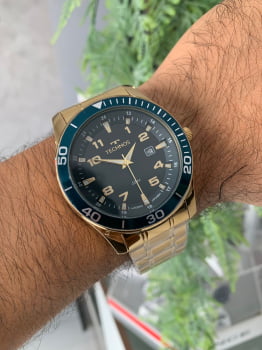 Relógio Technos Dourado Masculino com Calendário Visor Azul Maquinário Japonês Aço Inoxidável Á Prova d´água 2115MQLS/4A