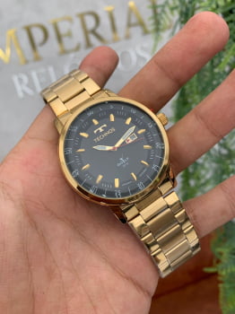 Relógio Technos Masculino Golf Dourado Visor Preto com Calendário Maquinário Japonês Aço Inoxidável á Prova D'água 2115LAP/1P